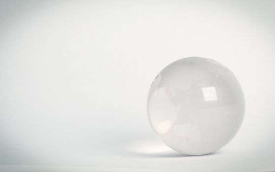 small glass globe.isolated on a white background.photo with copy space