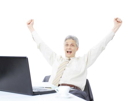 The businessman at the age of works for the laptop. Isolated on a white background.