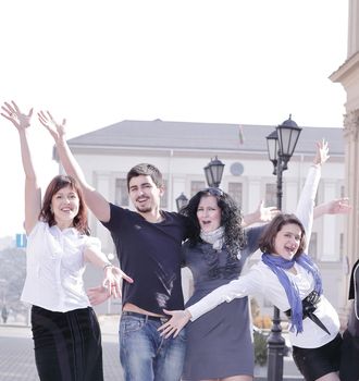 portrait group of happy students standing on the street .