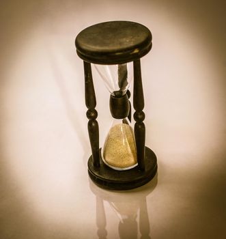 hourglass on dark background.the concept of time.photo with copy space