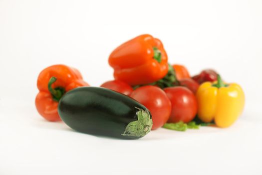 eggplant,tomatoes,peppers and a mobile phone.isolated on a white background.