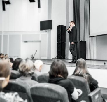 speaker with microphone for business conference. business presentations and business trainings