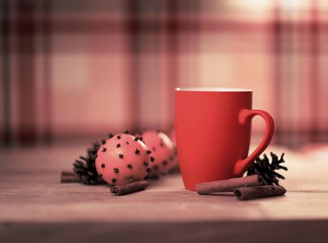 Mug Of Tea Or Coffee. Sweets. Christmas Decorations. Red Balls And Bells. Wooden Background.