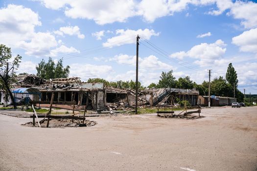 War in Ukraine. Crater from an explosion in the Sumy region. Russia's military invasion of Ukraine
