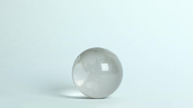 small glass globe.isolated on a white background.photo with copy space