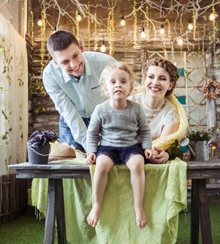 mother,father and their five year old daughter in the living room