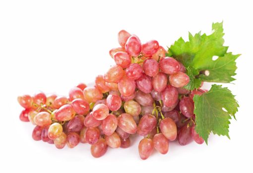 Ripe red grape with leaves isolated on white