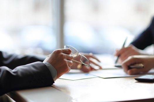 close up. two businessmen discussing financial information .photo with copy space