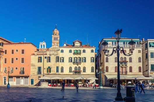 Venice, Italy, September 13, 2019: Campo Santo Stefano square with typical venetian buildings and Santo Stefano Bell Tower in historical city centre San Marco sestiere, Veneto region