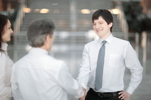 Manager welcomes the client with a handshake .photo with copy space