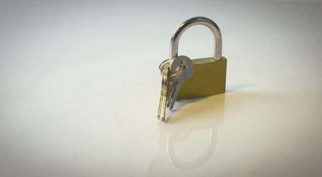lock and key.isolated on a dark background.photo with copy space.