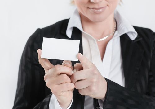 successful business woman showing blank credit card .isolated on white .