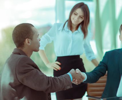 welcoming handshake of a Manager and the customer in the office.