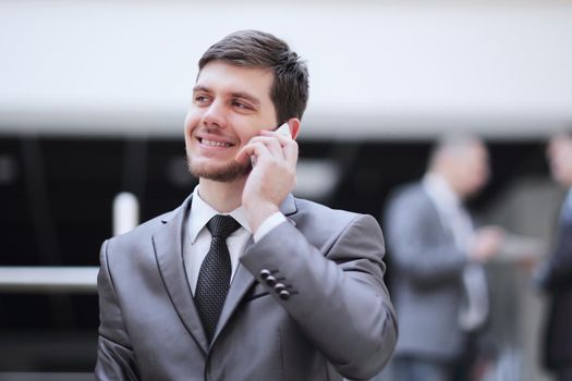 portrait of handsome businessman on blurred office background.photo with copy space