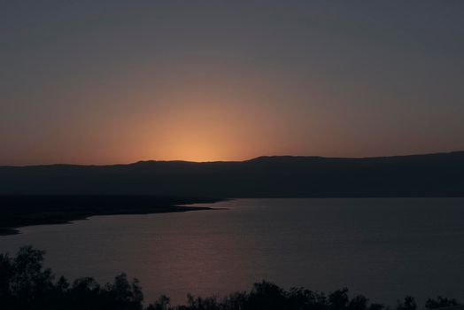 Orange sunrise reflecting off of the Dead Sea. High quality photo