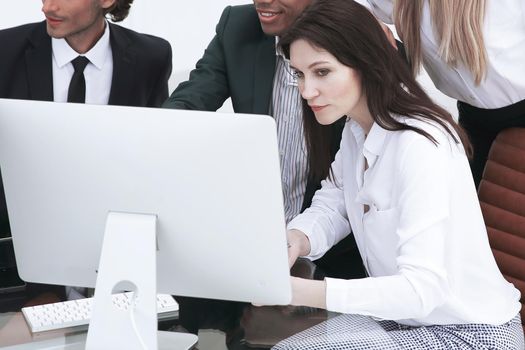 business people discussing financial information,sitting at his Desk.the concept of teamwork