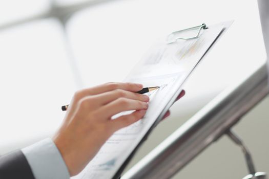 Close up businessman working with graph data at office.