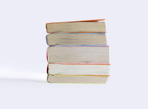 small stack of books.isolated on white background.photo with copy space.