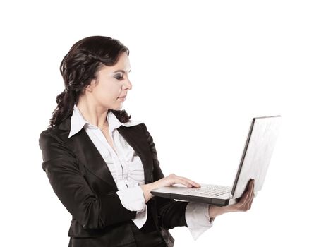 Portrait of a young happy business woman with a laptop over white background.