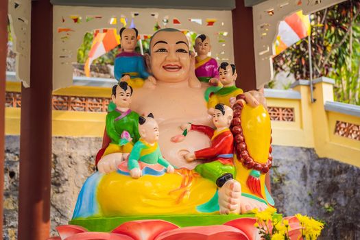 Colored buddha in vietnamese style. Vietnam temple.