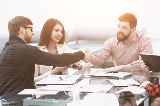 Two business colleagues shaking hands during meeting.Business concept. Team work.