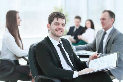 business man at office with his business team working behind.photo with place for text