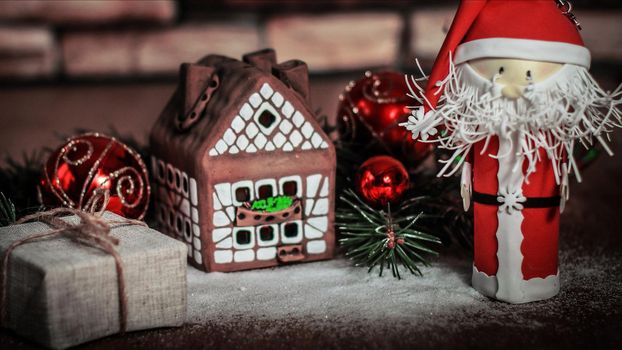 Christmas present on the background of a gingerbread house.photo with copy space