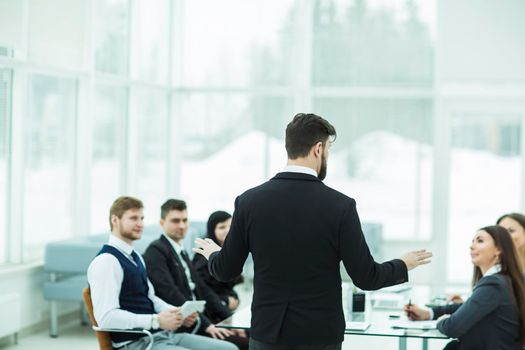 CEO speaks at the workshop business team in a modern office. the photo has a empty space for your text.