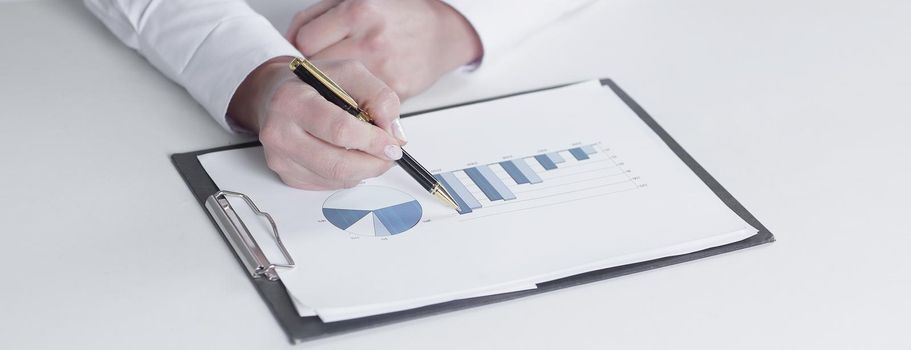 closeup.business woman checking marketing graphics.isolated on white.