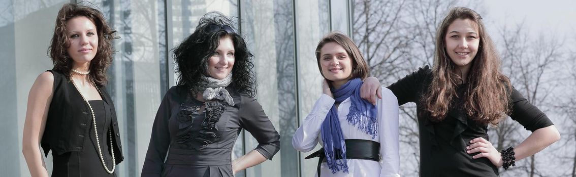 portrait of office colleagues standing near the office building