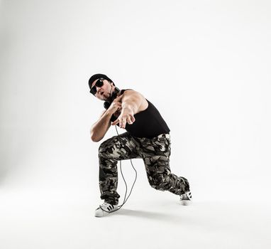 energetic and charismatic guy rapper dances break dance.the photo has a empty space for your text