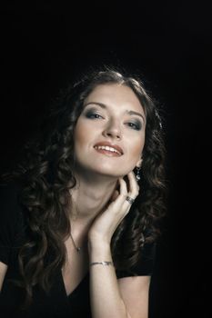 closeup. portrait of beautiful woman with evening make-up.isolated on black background