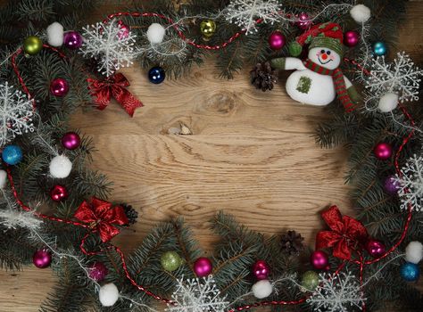 beautifully decorated Christmas wreath on wooden background .photo with place for text .