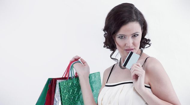 successful young woman with shopping and credit card.isolated on a light background