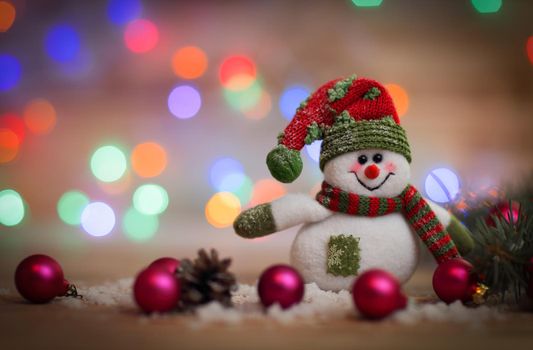 Christmas card. toy snowman on Christmas background.photo with place for text