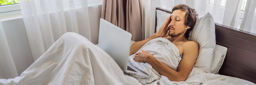 Male patient is sick while lying in his bed and calls an online doctor through a gadget. BANNER, LONG FORMAT
