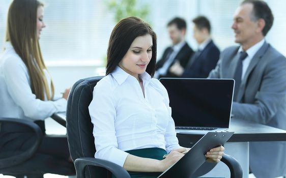 young business business woman reading document, sitting in the office .photo with place for text