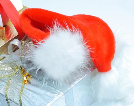 closeup.boxes with gifts and a Santa Claus hat.isolated on white background