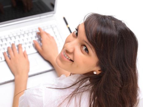 closeup.young woman working on laptop. the view from the top.isolated on white background