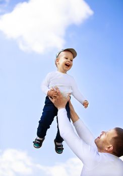 happy father and son on a walk in a Sunny day