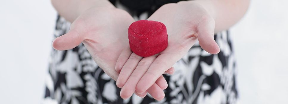 closeup.young woman holding gift on Valentine's day