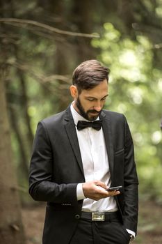 communication and the Internet. businessman with smartphone in the Park