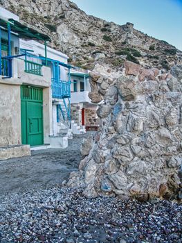 Scenic picturesque greek fishing village Klima with traditional houses and colorful windows and doors In Milos island, Greece