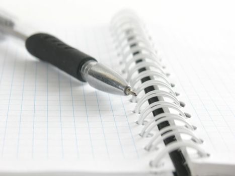 close up.ballpoint pen on open notebook background.