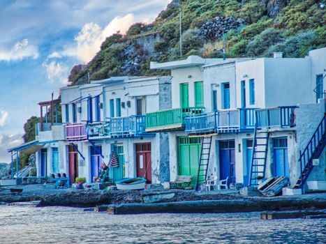 Scenic picturesque greek fishing village Klima with traditional houses and colorful windows and doors In Milos island, Greece