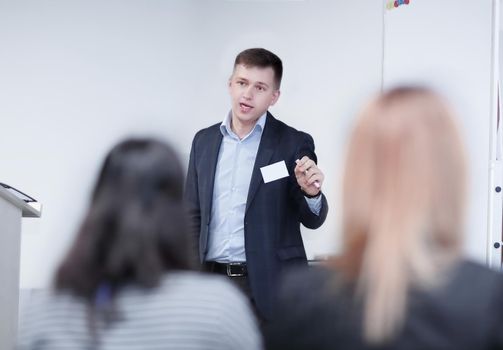 Young Businessman Giving Speech In The Conference.photo with place for text