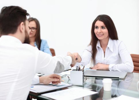 business woman is shaking hands with an employee at a work meeting.teamwork