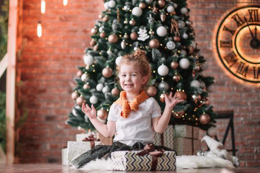 portrait of cute little girl with Christmas gifts . the concept of Christmas