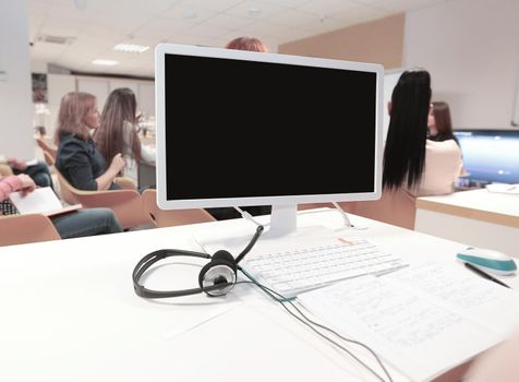 close up. the computer monitor on the table in the conference room.people and technology