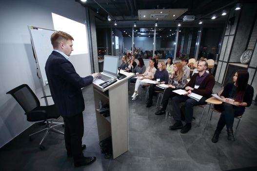 project Manager conducts a meeting of senior staff.business concept